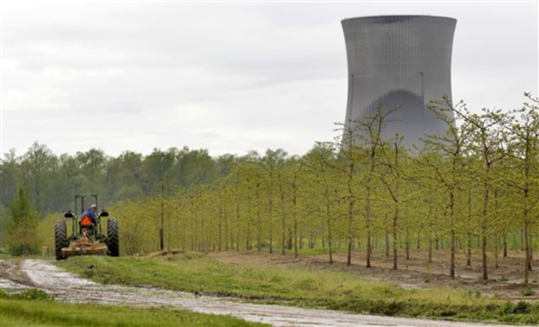 A tree farm in North Perry, Ohio, near the two cooling towers of the Perry Nuclear Power Plant looming in the background. The risk of an earthquake causing a severe accident at a nuclear power plant is up to 24 times greater than previously believed, according to an AP analysis of preliminary government data.